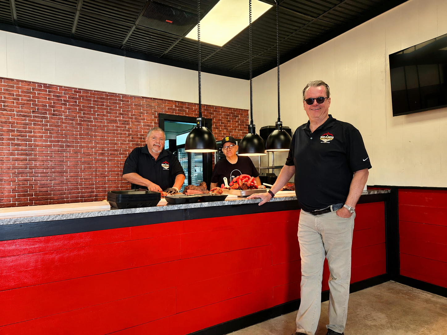 The DynOmite BBQ team behind the counter